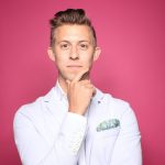 man in white suit jacket